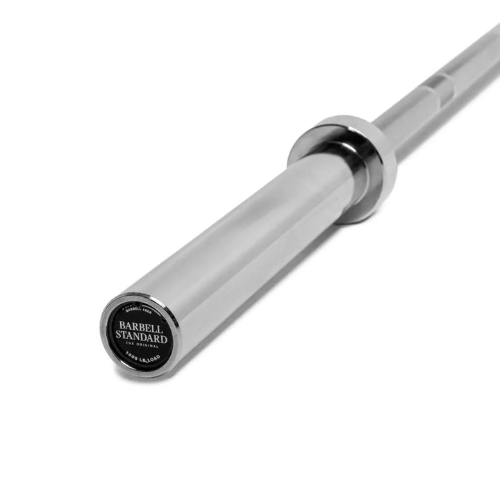 Barbell Standard 1000 compact weight set with multiple plates and barbell for strength training and fitness workouts.