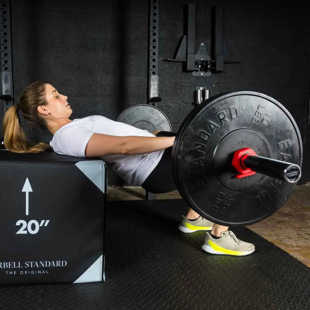 Barbell Standard 1000 Compact Barbell showing a sturdy metal barbell with textured grip and weight plates attached.