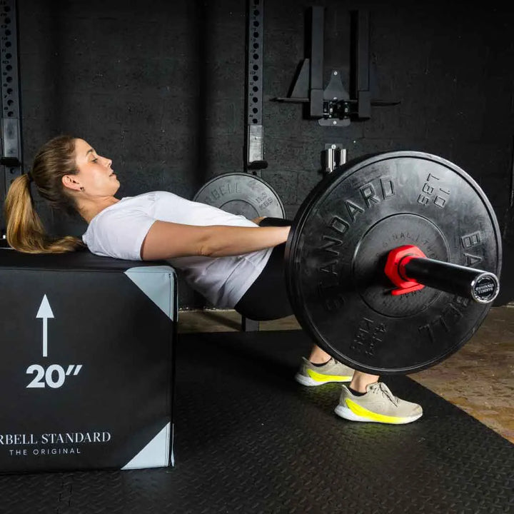 Barbell Standard 1000 Compact Barbell showing a sturdy metal barbell with textured grip and weight plates attached.