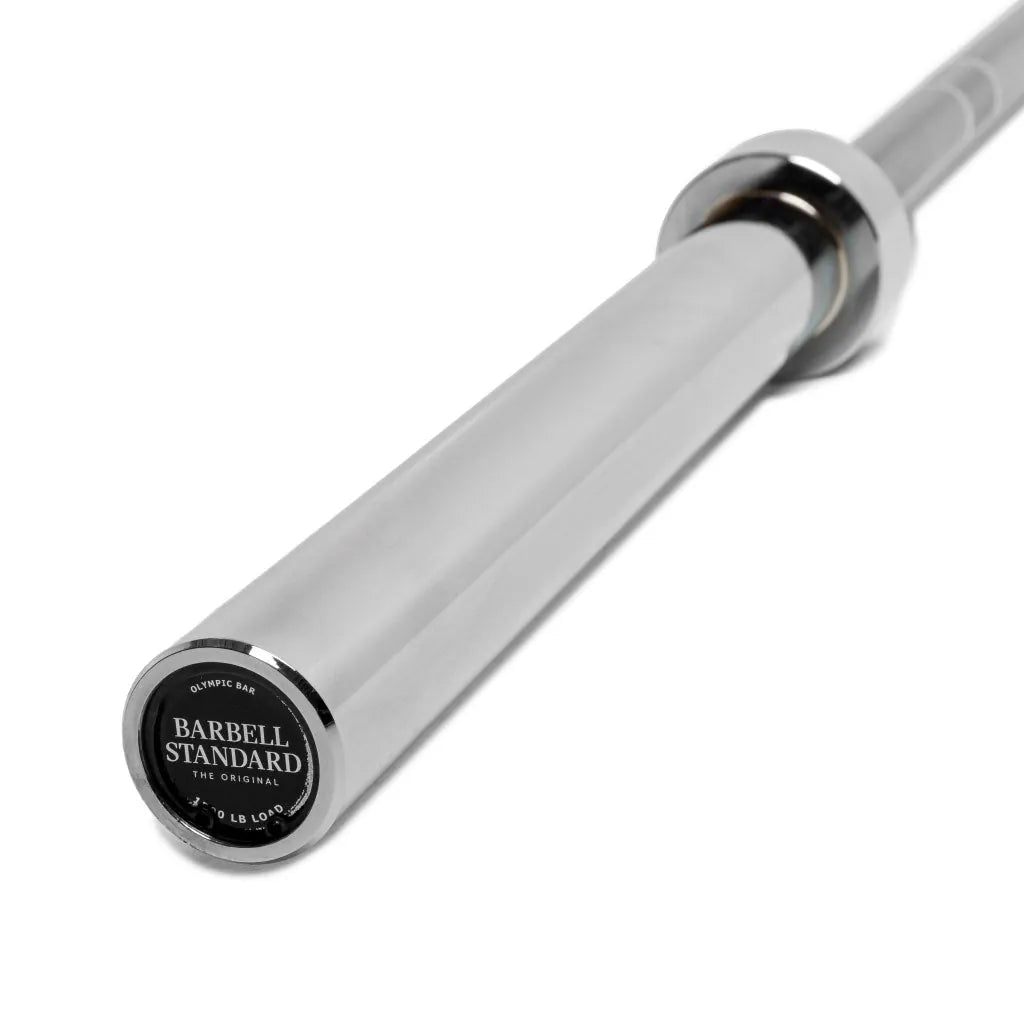 Olympic Barbell 1500 set by Barbell Standard with weight plates and clamps for strength training and weightlifting.