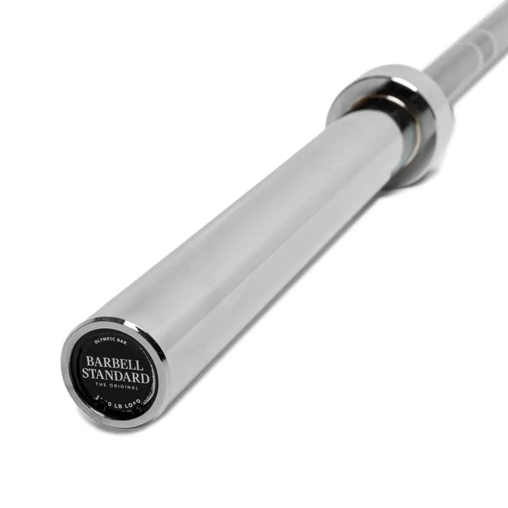Olympic Barbell 1500 set by Barbell Standard with weight plates and clamps for strength training and weightlifting.