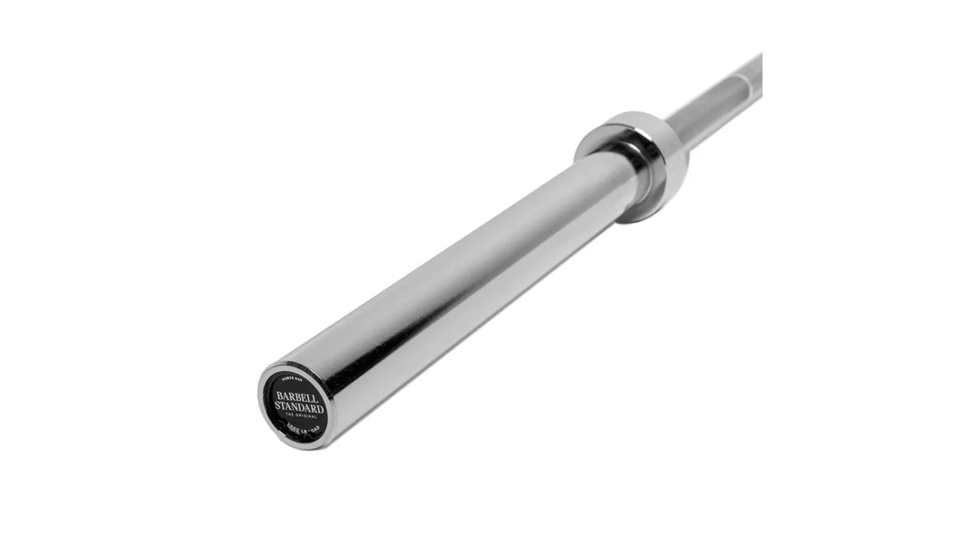 Barbell Standard 2000 Power Barbell with sturdy metal construction and knurled grip for weightlifting and strength training.
