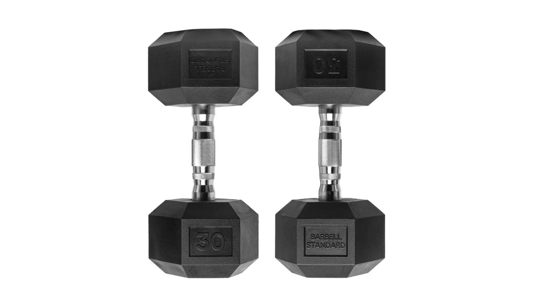 Pair of black Rubber Hex Dumbbells by Barbell Standard with textured handles for grip, used for strength training and weightlifting.