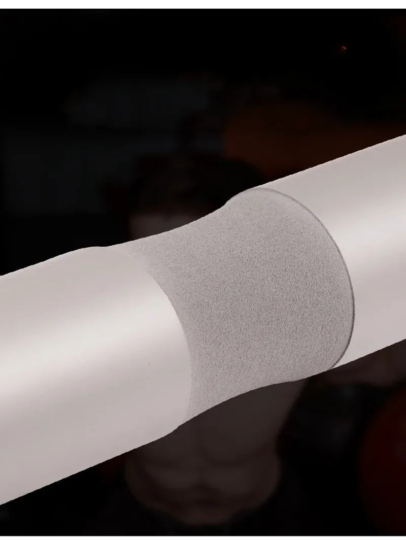 The Peak Pivot Ultimate Barbell Squat Pad wrapped around a barbell for comfortable weightlifting support.