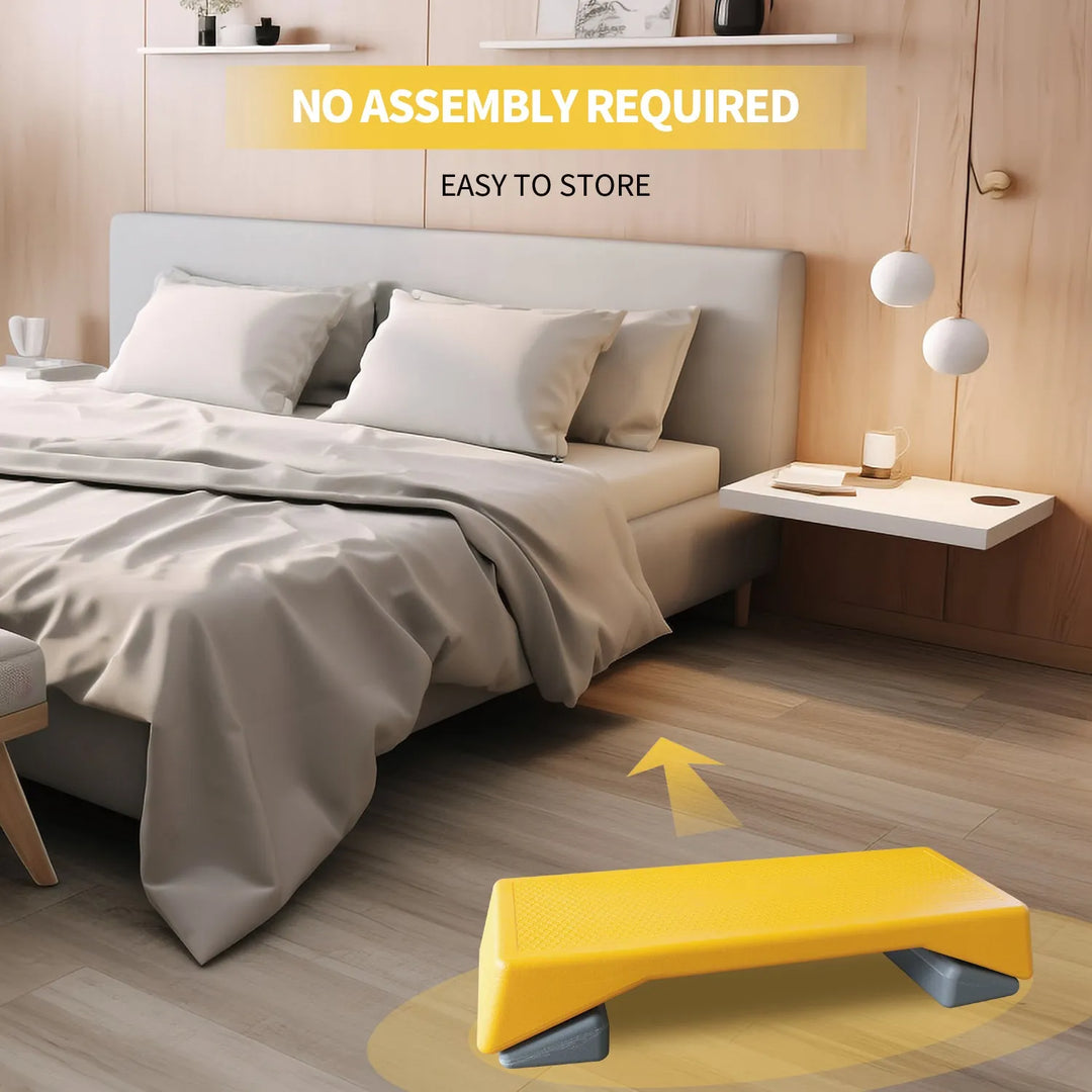 Yellow adjustable aerobic step platform for home workouts with non-slip surface and sturdy design by The Peak Pivot.