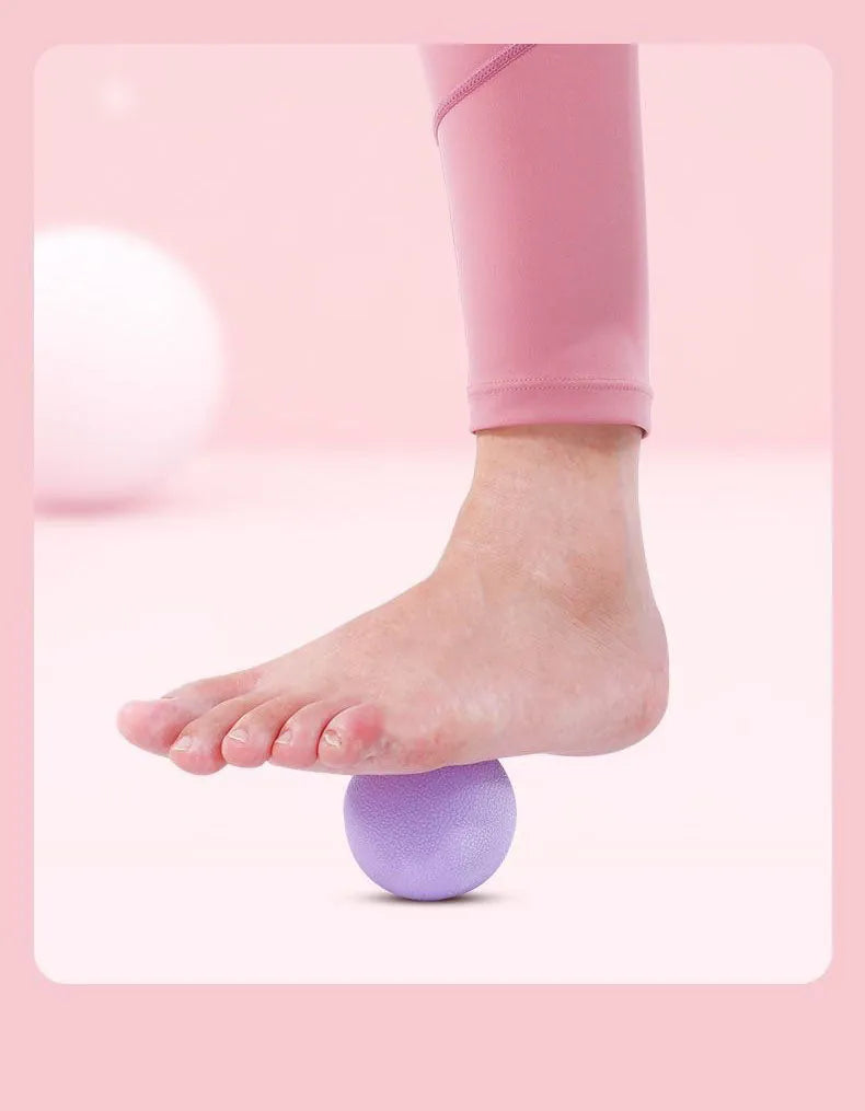 massage ball for deep tissue relief, shown in hand with textured surface for muscle therapy.