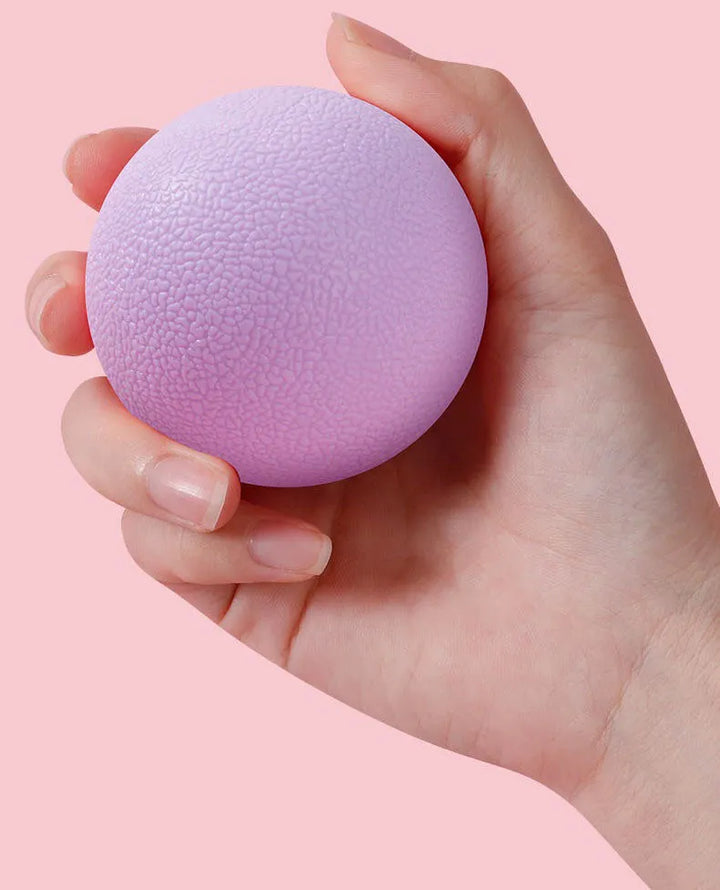  massage ball for deep tissue relief, showing textured surface and compact size for targeted muscle massage.