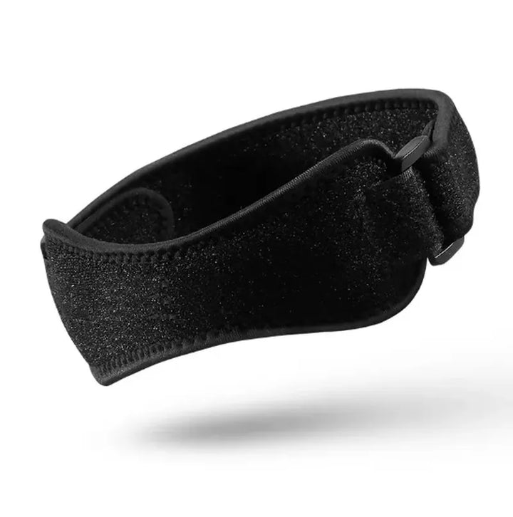 Adjustable knee band from The Peak Pivot designed for joint pain relief, showing a close-up of the strap wrapped around the knee.