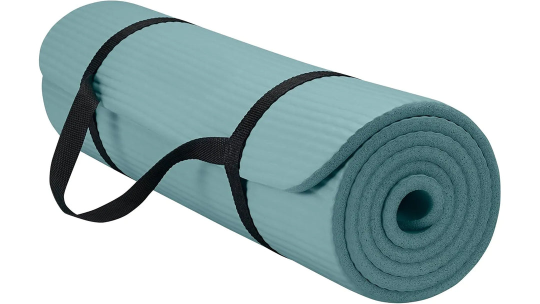 The Peak Pivot Gaiam Essentials yoga mat in balsam color, showing textured surface and rolled-up design for yoga practice.