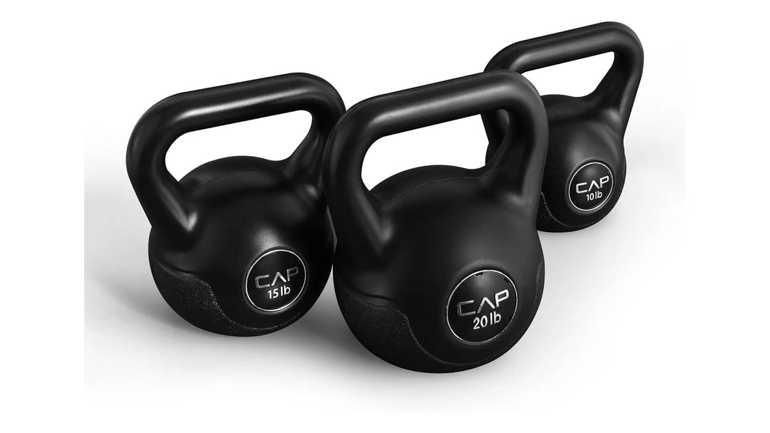 Set of CAP kettlebells from The Peak Pivot, featuring various weights with black handles and colorful weight markings for strength training.