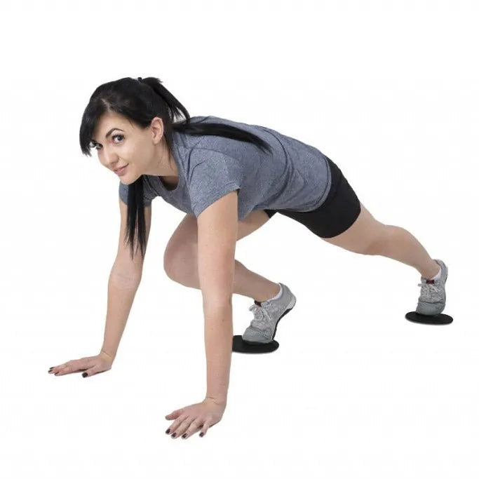 Pair of Synergee Core Sliders for abdominal training, showing smooth surface and versatile design for core exercises.