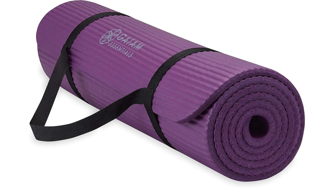 Purple Gaiam Essentials Yoga Mat by The Peak Pivot, textured surface and cushioned design for comfortable yoga practice.