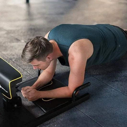 Home gym squat machine by The Peak Pivot, 8-in-1 full-body trainer with bench, rack, and bar for strength training exercises.