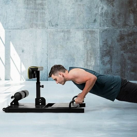 Home gym squat machine by The Peak Pivot, 8-in-1 full-body trainer with bench, racks, and bars for versatile strength workouts.