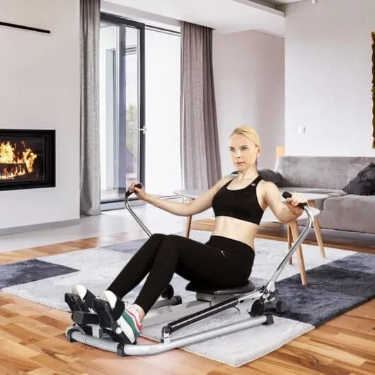 Hydraulic rowing machine from The Peak Pivot for full-body home workouts, featuring adjustable resistance and ergonomic design.