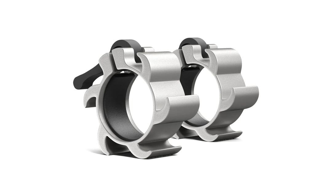 Synergee aluminum barbell collars securing weight plates during lifts on a gym setting.