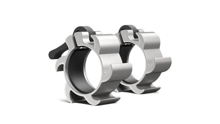 Synergee aluminum barbell collars securing weight plates during lifts on a gym setting.