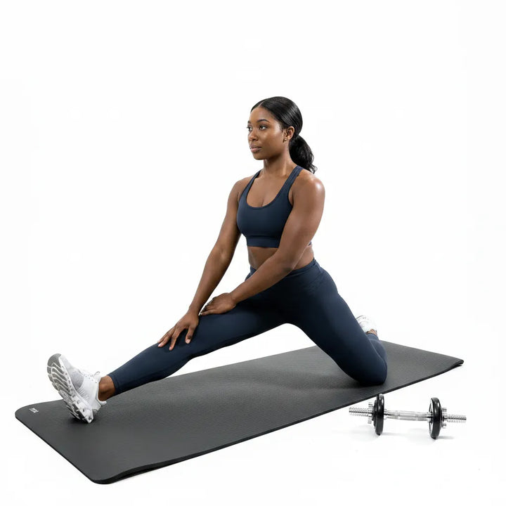 Extra-thick 12mm high-density NBR yoga mat by The Peak Pivot, showing textured surface and vibrant color for comfortable practice
