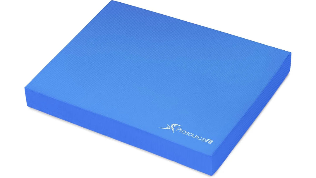 Non-slip foam balance pad with textured surface for stability during exercise or physical therapy.