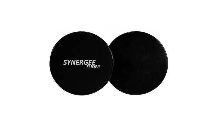 Synergee core sliders for abdominal training, showing smooth plastic discs on a wooden floor for core strengthening exercises.