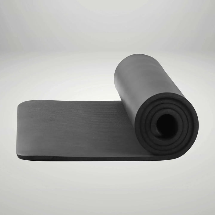 Extra-thick 12mm high-density NBR yoga mat by The Peak Pivot, showing textured surface ideal for comfort and stability during yoga.