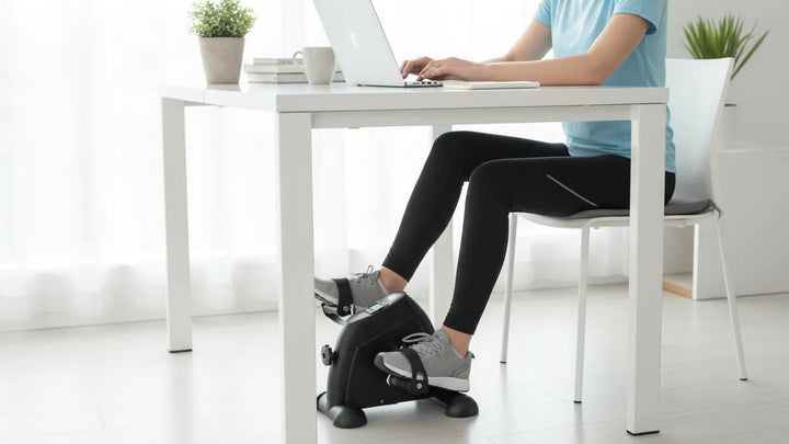 Adjustable mini bicycle exerciser from The Peak Pivot designed for under desk use, featuring compact size and pedal motion.