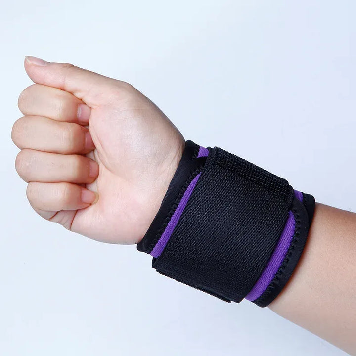 Adjustable wrist support brace by The Peak Pivot, featuring a strap and breathable material for secure comfort and stability.
