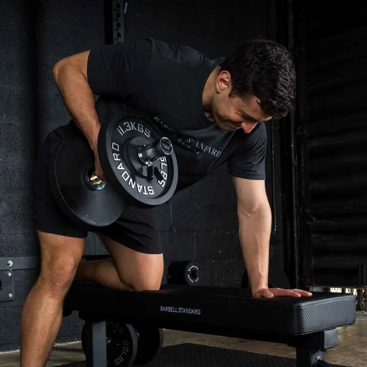 Pair of Barbell Standard Loadable Dumbbell Bars with adjustable weight plates for strength training exercises.