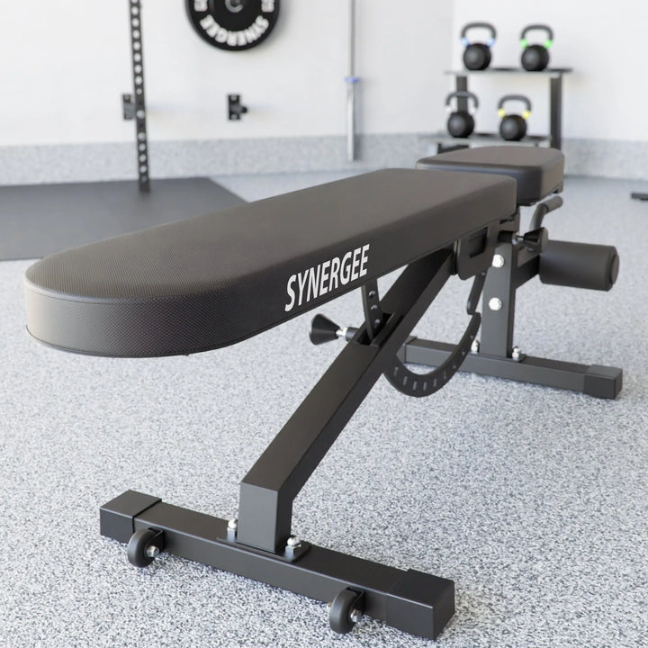 Synergee adjustable weight bench with padded seat and backrest, suitable for strength training and versatile workout routines.